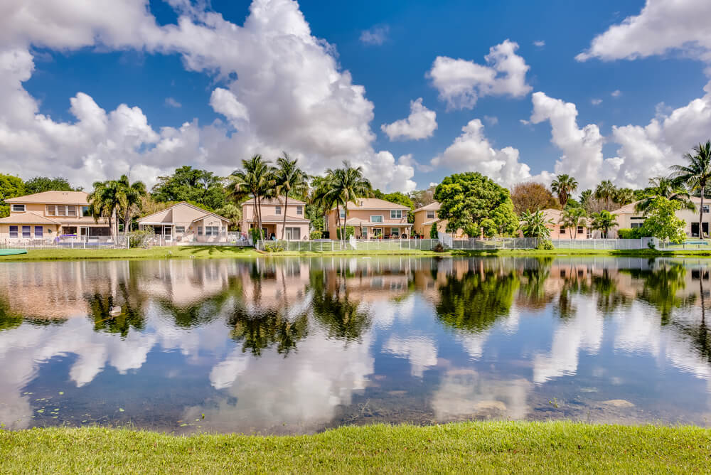 COCONUT CREEK, FL, USA: View of a lake and surrounding homes.